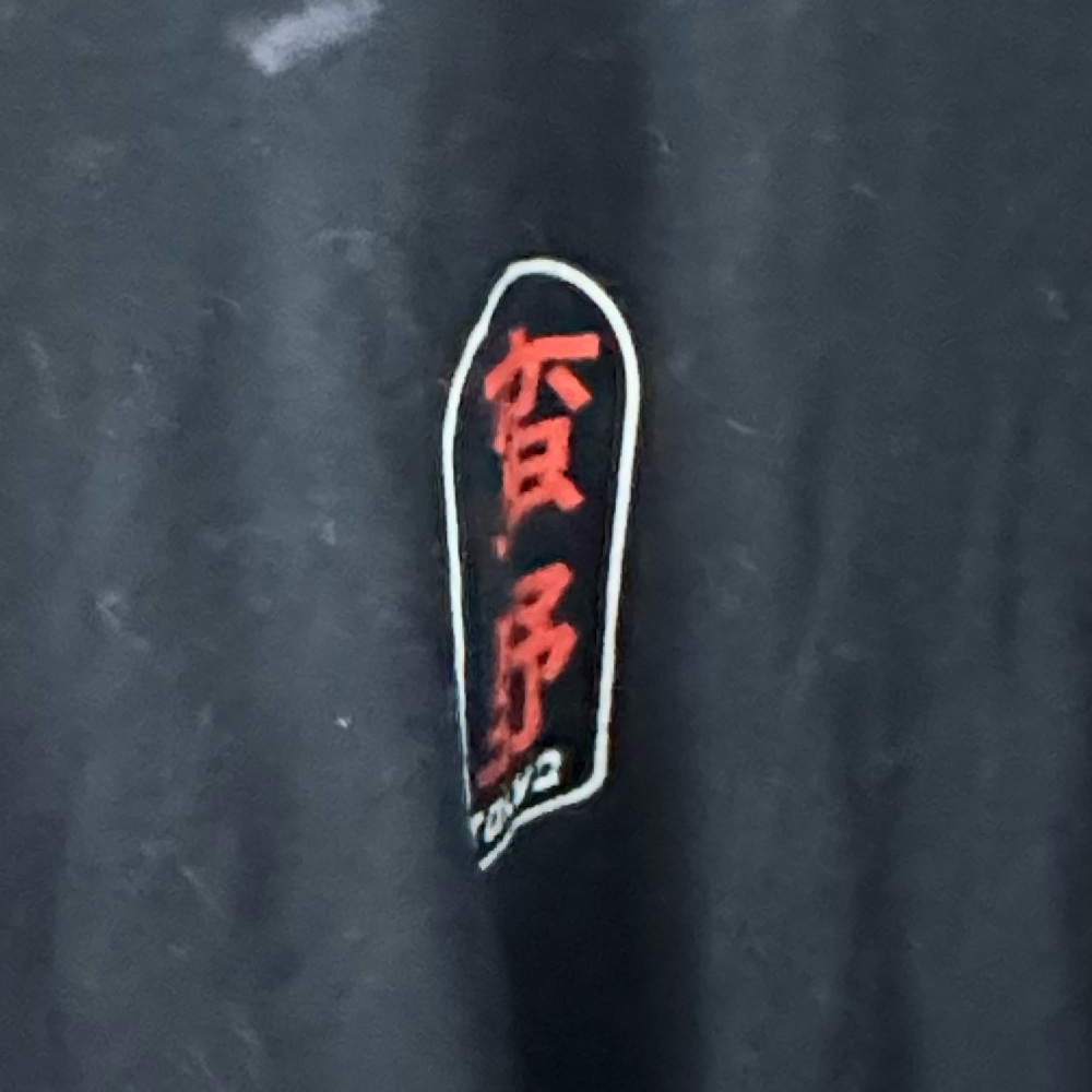 Fresh laundry Tokyo orange and white graphic. Black T-shirt